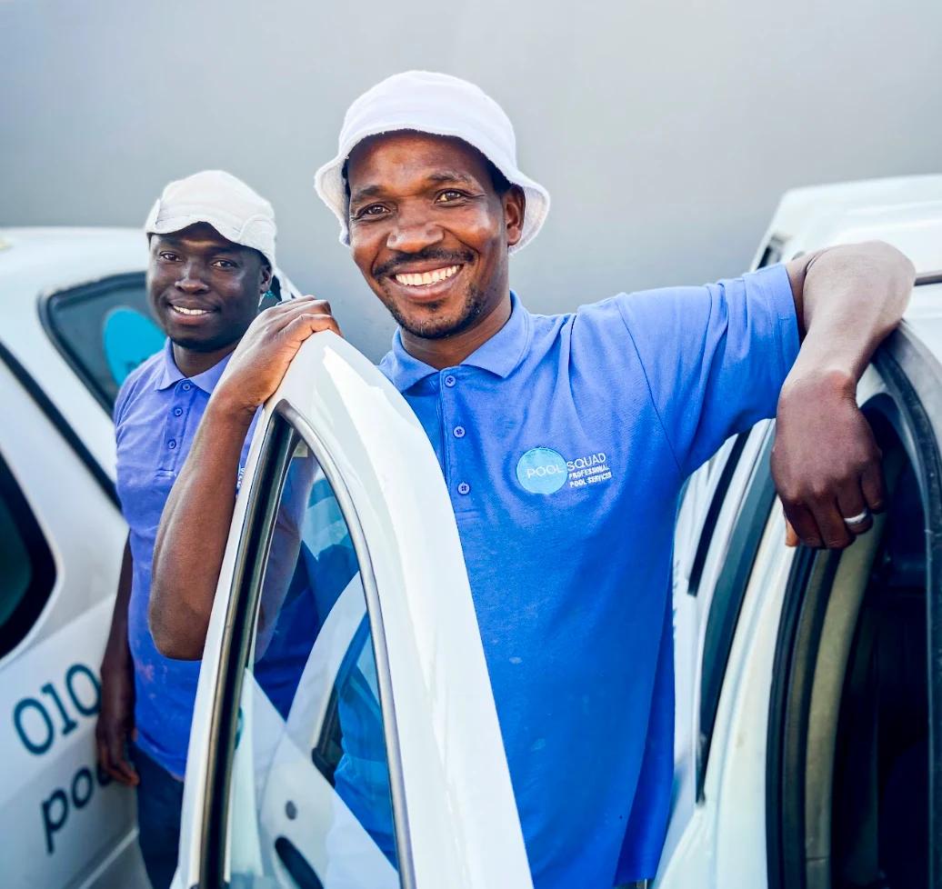 Pool Squad technicians in front of their service vehicle